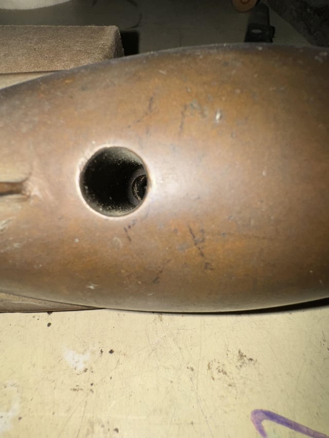 r/whatisthisthing - Can anyone identify this metal object found in a 1950s garage? It looks like some sort of military shell but there are no markings.