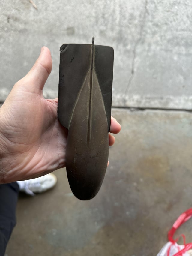 r/whatisthisthing - Can anyone identify this metal object found in a 1950s garage? It looks like some sort of military shell but there are no markings.